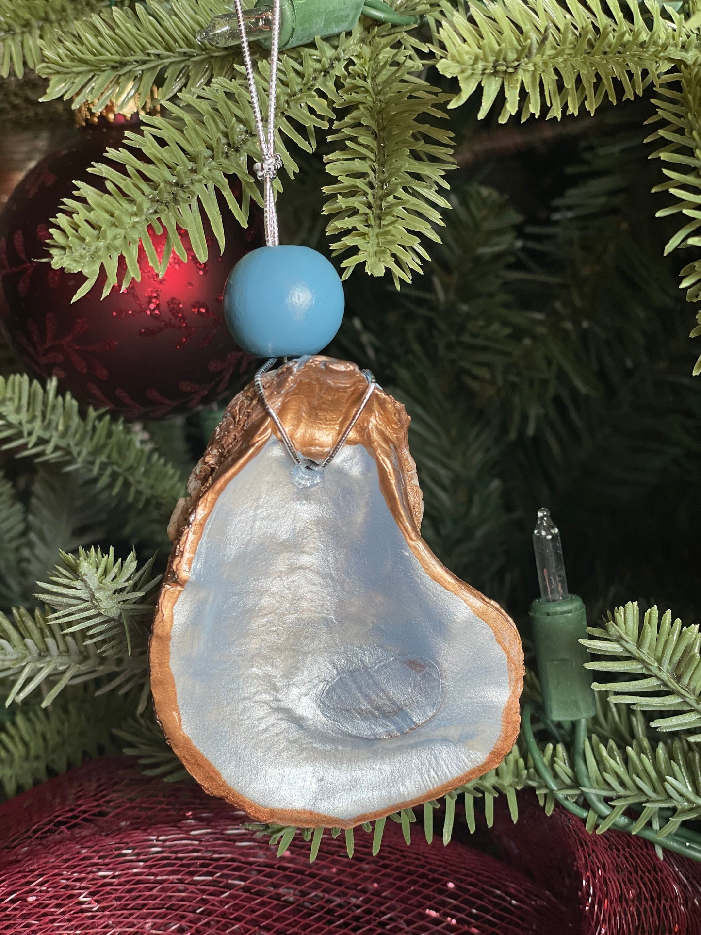 Icy blue metallic oyster ornament