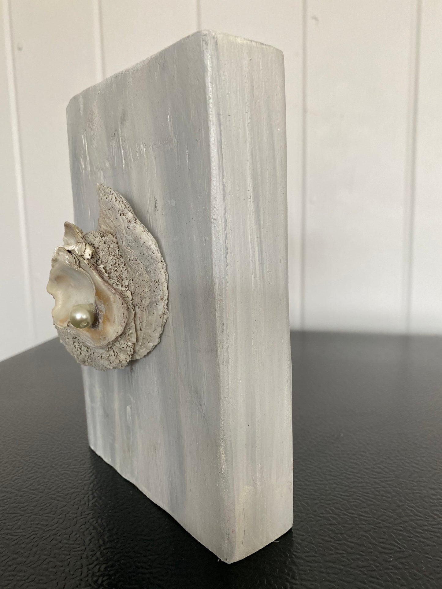 Oyster decor on wooden block