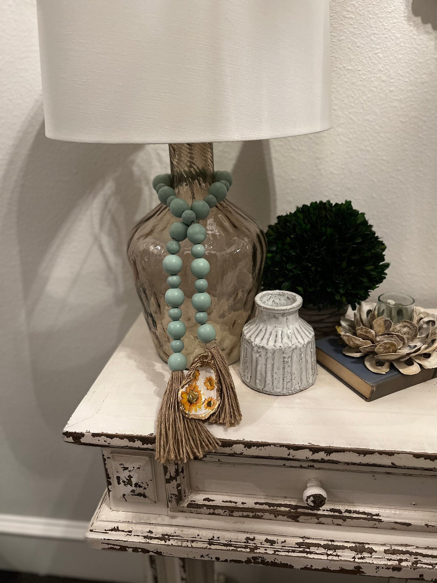 Decoupaged Oyster prayer beads with twine tassels