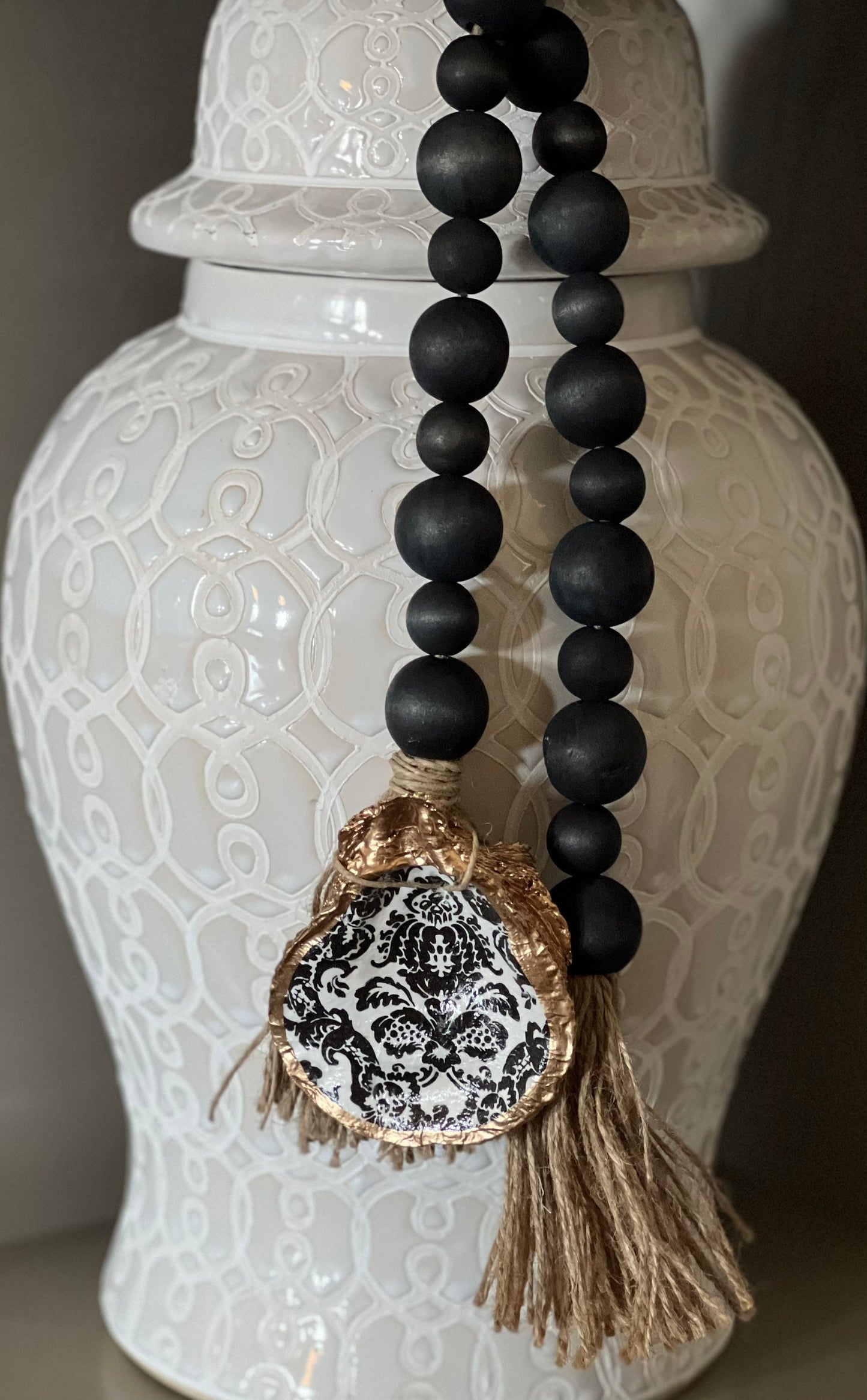 Decoupaged oyster shell prayer beads