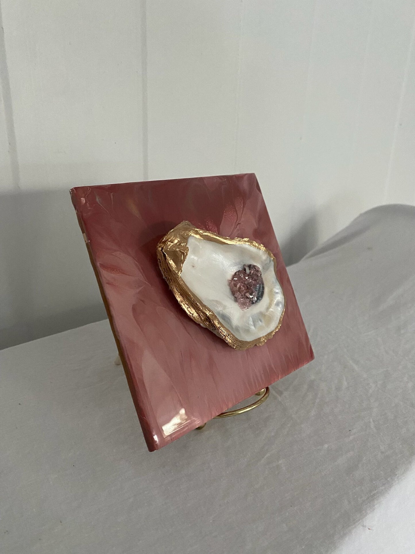 Oyster accented pink ceramic tile