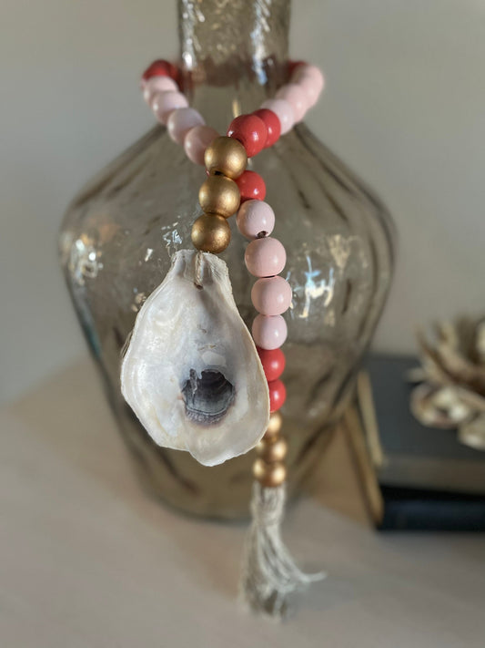 Oyster prayer beads with twine tassel