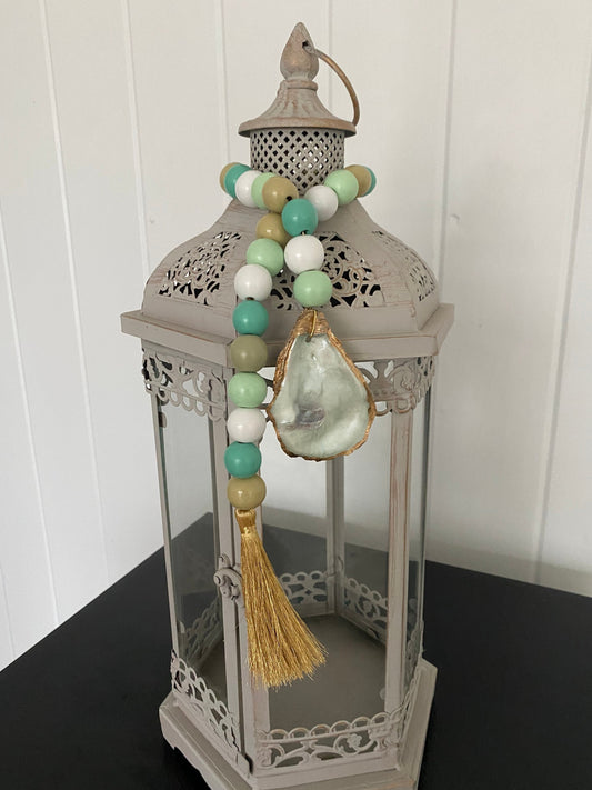 Oyster prayer beads with gold tassel
