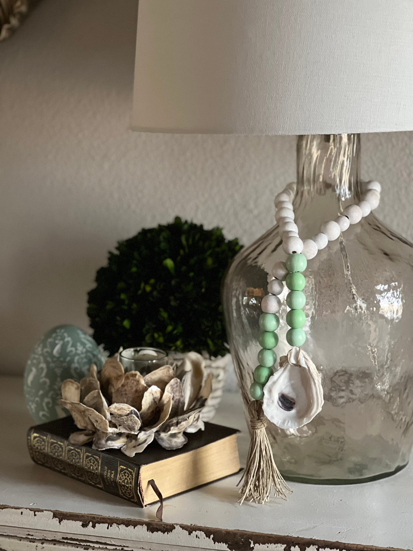 Oyster prayer beads with twine tassel