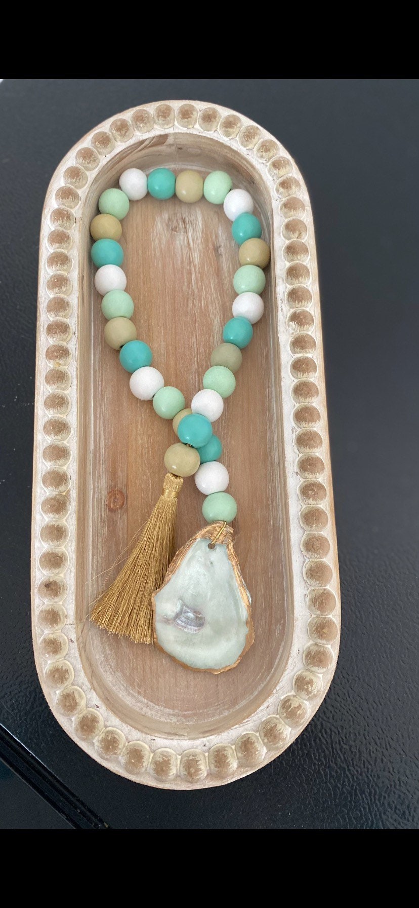 Oyster prayer beads with gold tassel