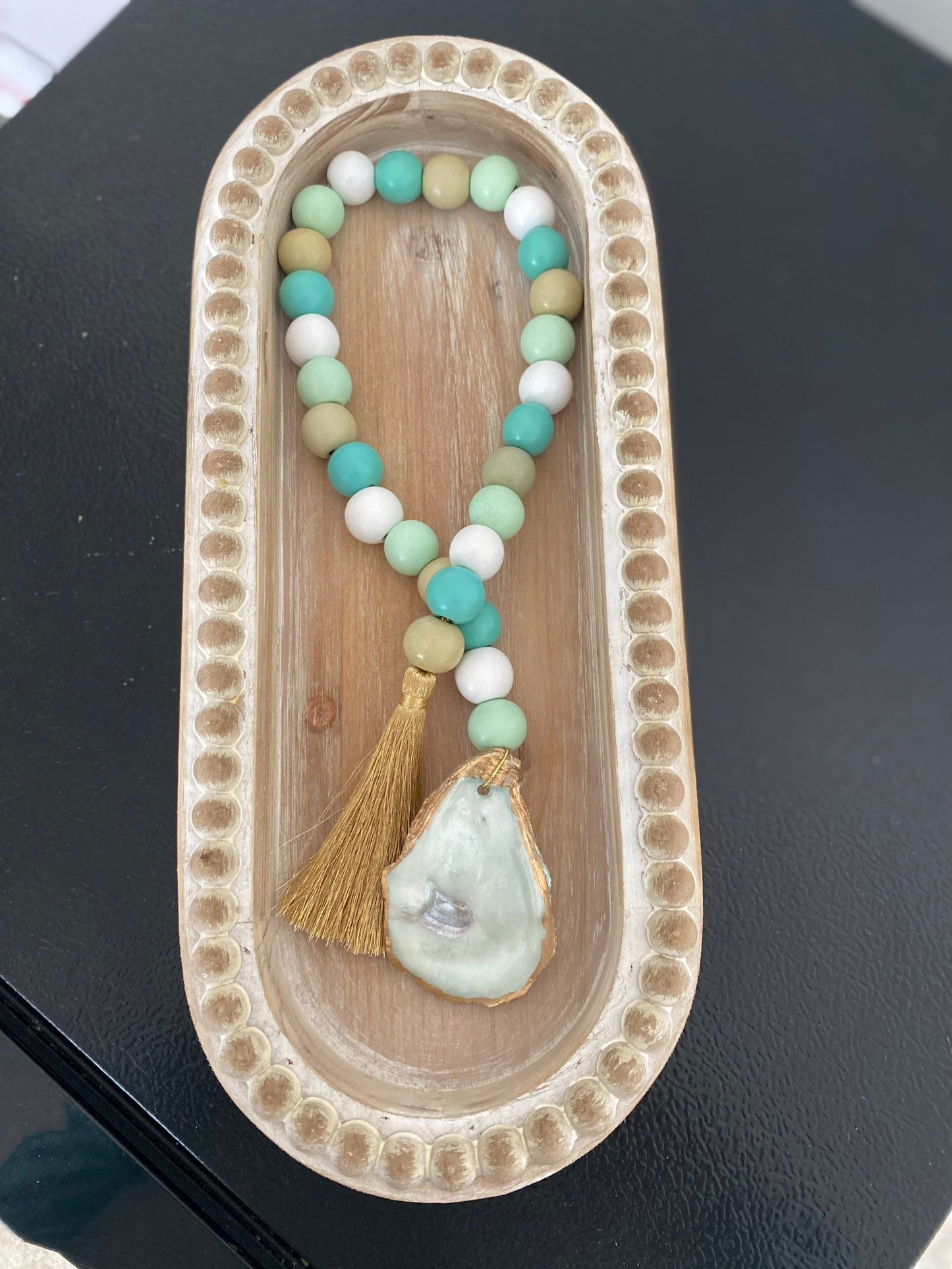 Oyster prayer beads with gold tassel