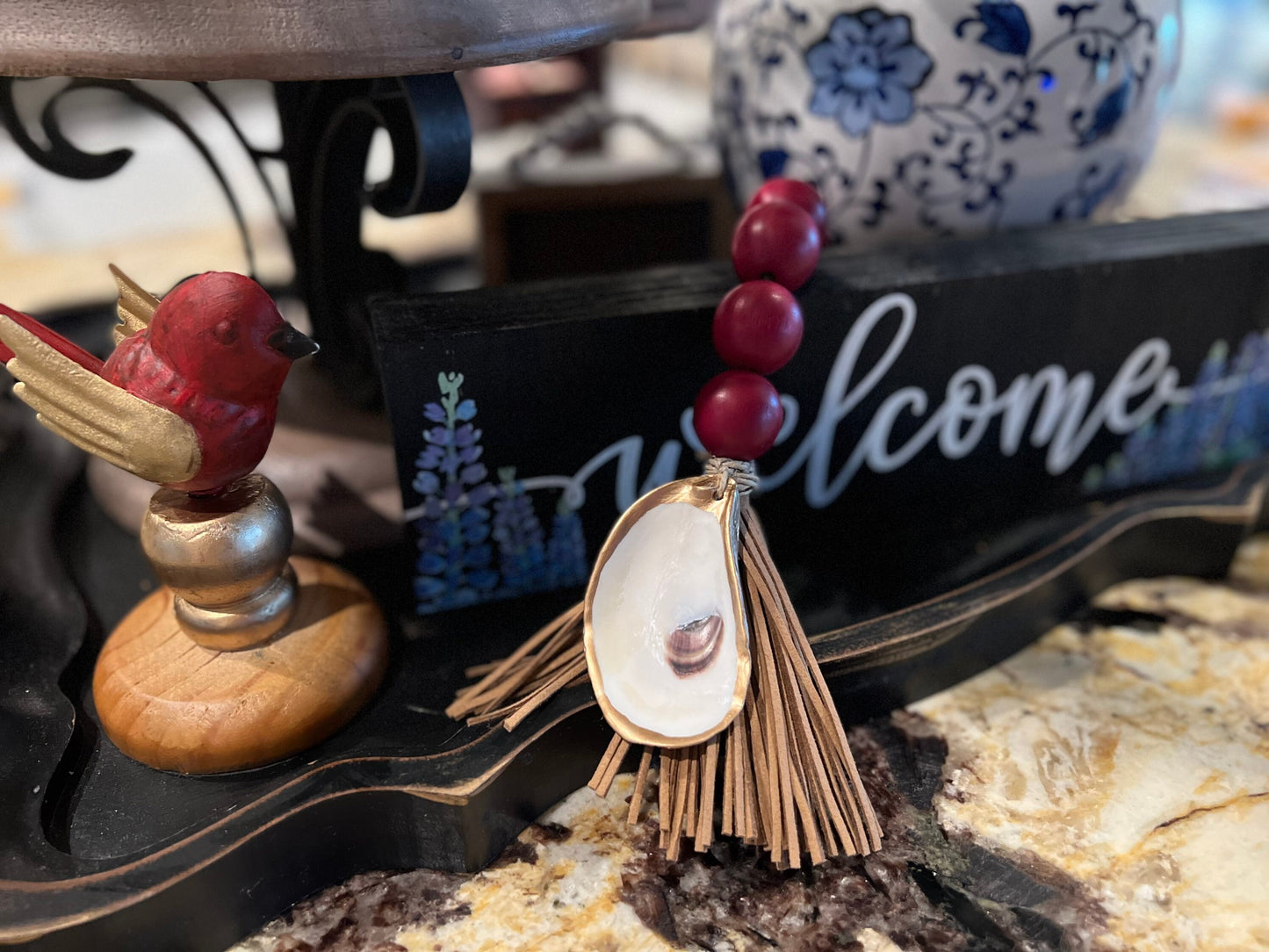 Gilded oyster Beaded decor with faux leather tassel