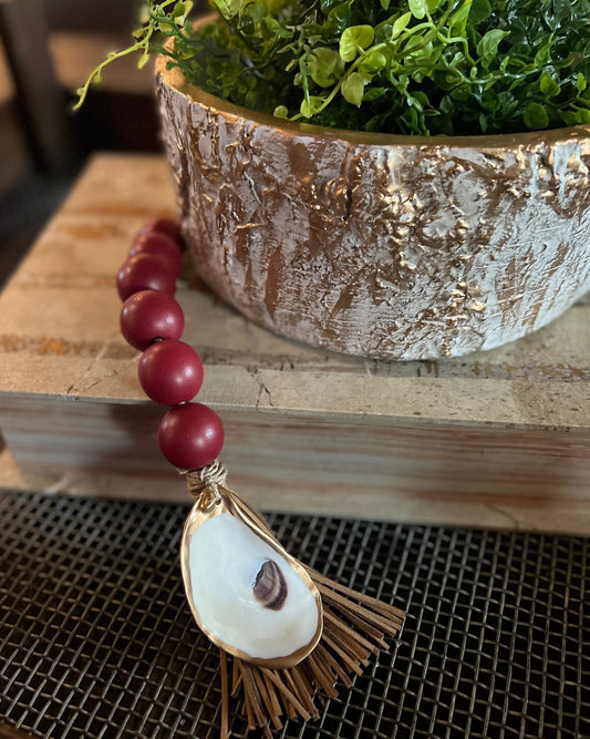 Gilded oyster Beaded decor with faux leather tassel