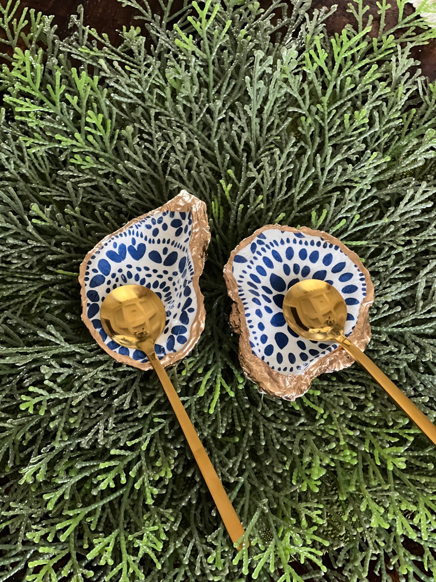 Gilded and decoupaged oyster shell salt/pepper dishes with spoons
