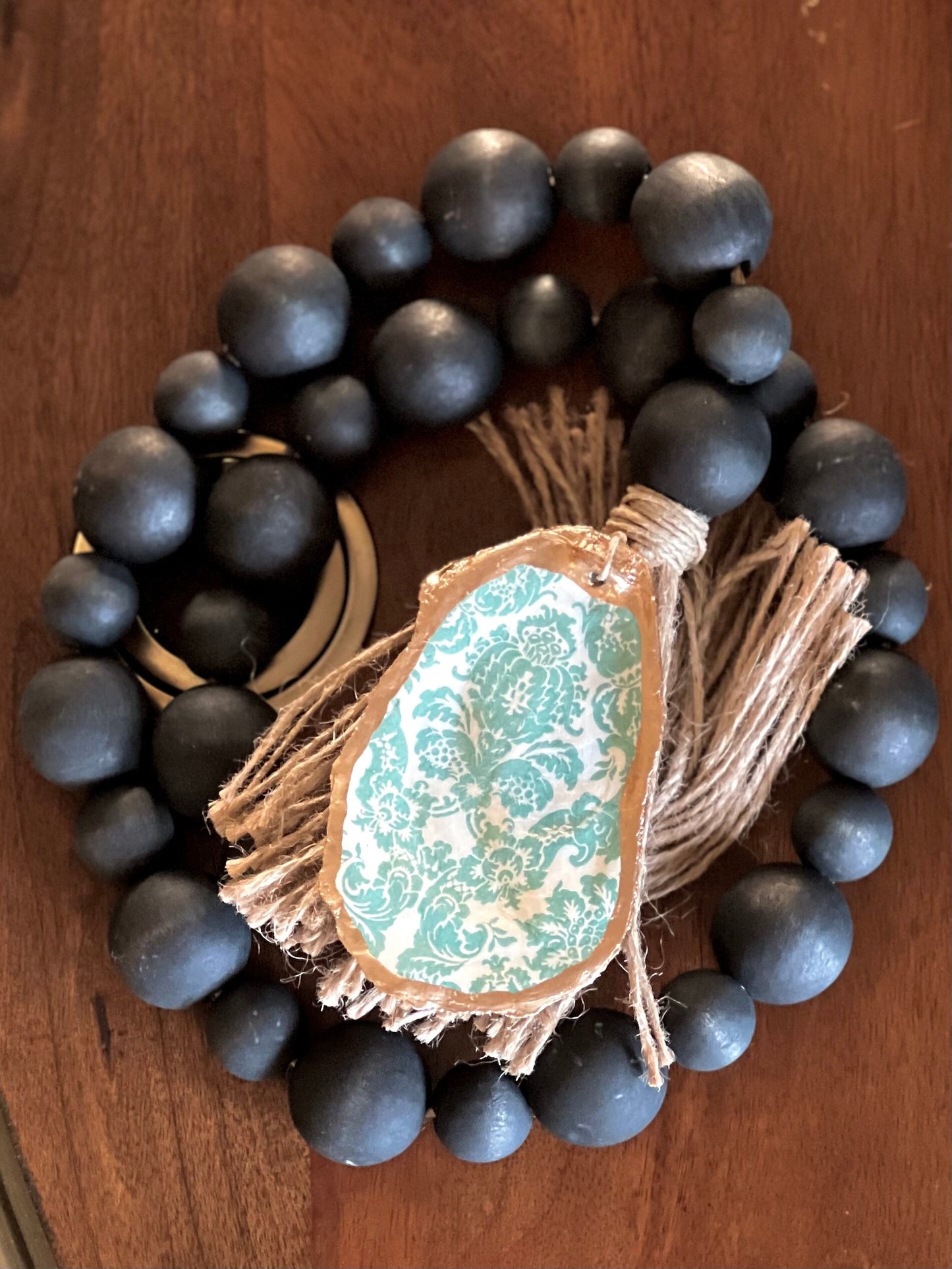 Decoupaged Oyster prayer beads with twine tassels