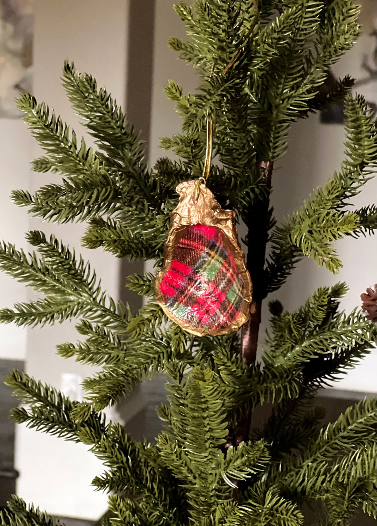 Decoupaged and gilded oyster shell ornament