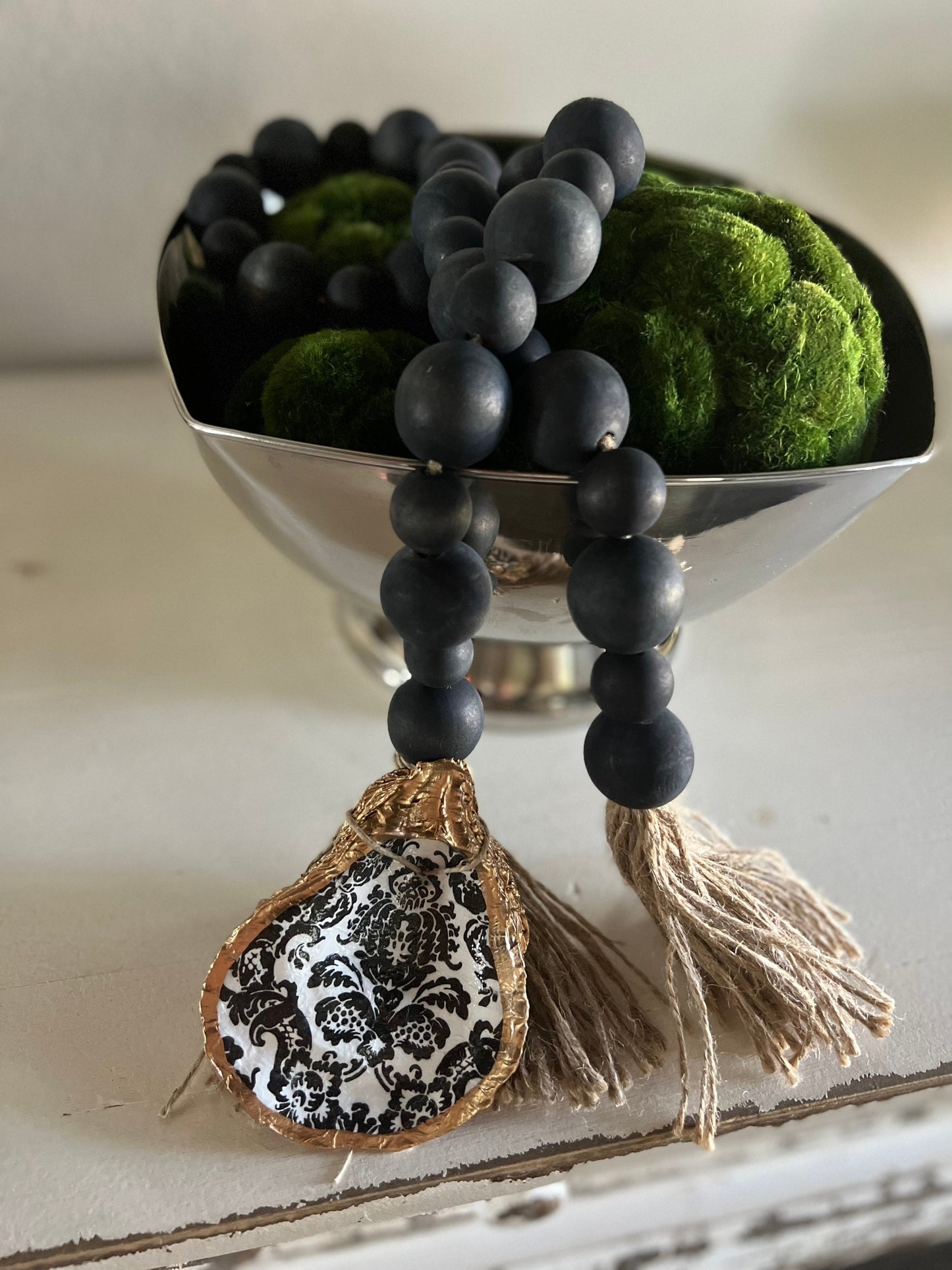 Decoupaged oyster shell prayer beads
