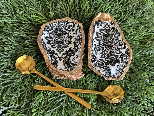 Gilded and decoupaged oyster shell salt/pepper dishes with spoons
