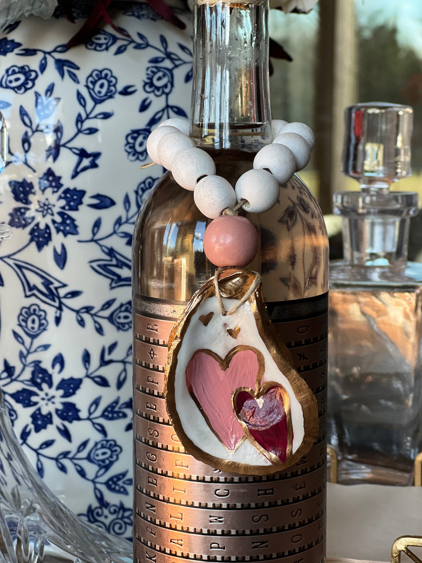 Hand-painted heart oyster shell bottle charm